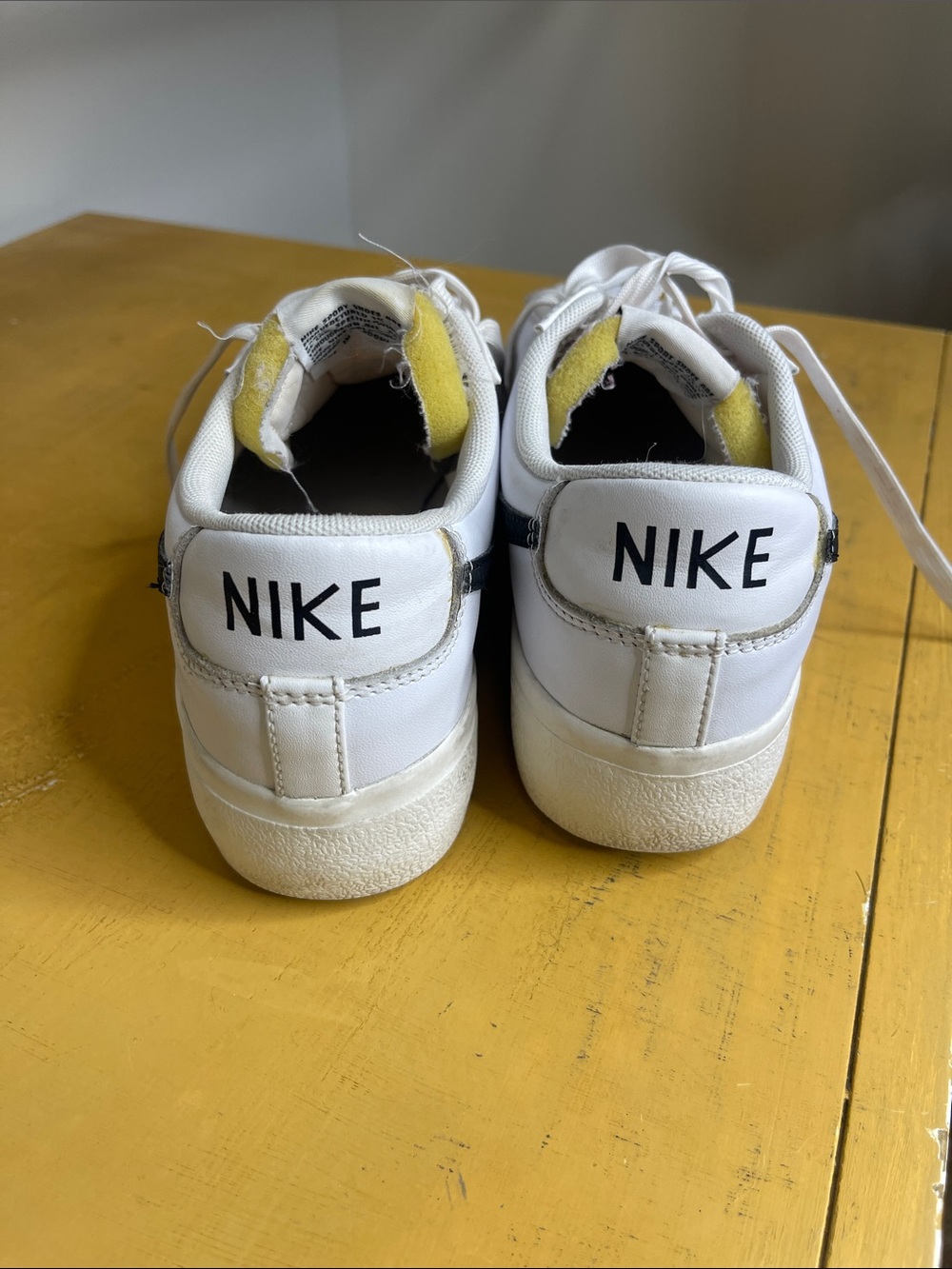 Nike White Sneakers with Black Swoosh and Gray Suede Accents - Picture 2 of 5
